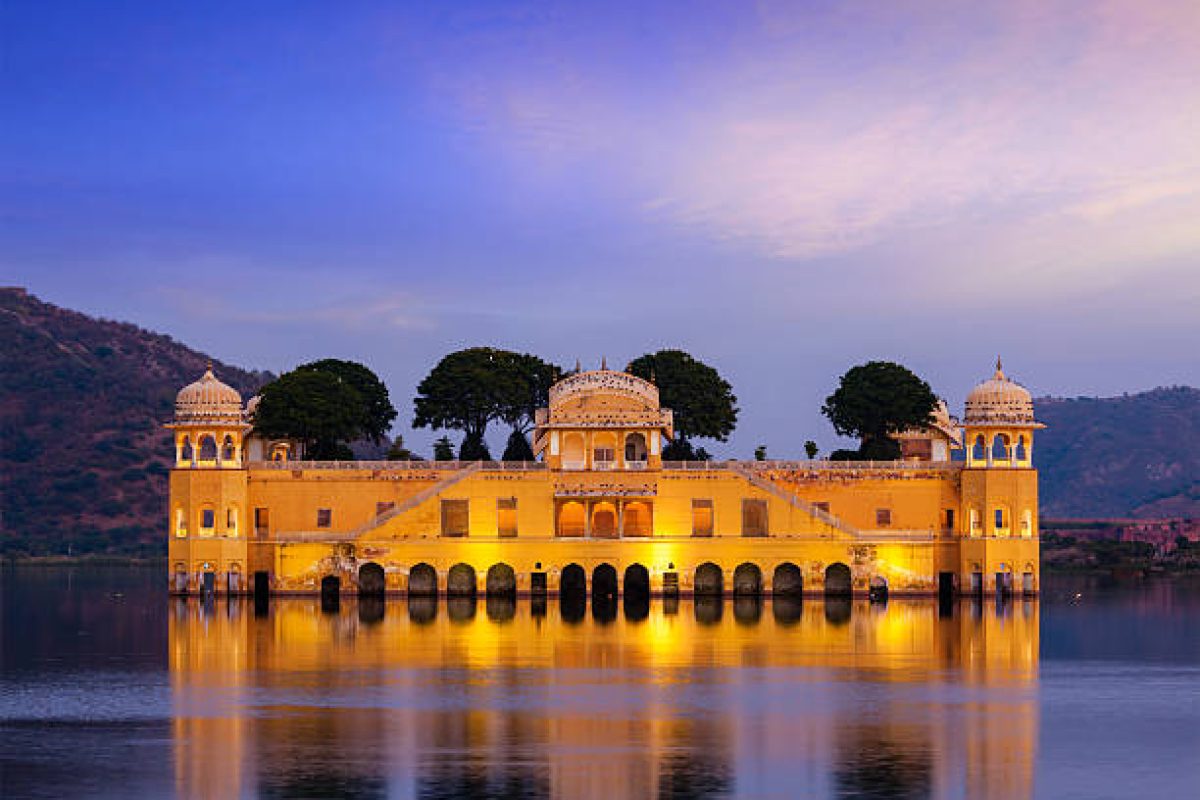 Rajasthan landmark - Jal Mahal Water Palace on Man Sagar Lake in the evening in twilight. Jaipur, Rajasthan, India
